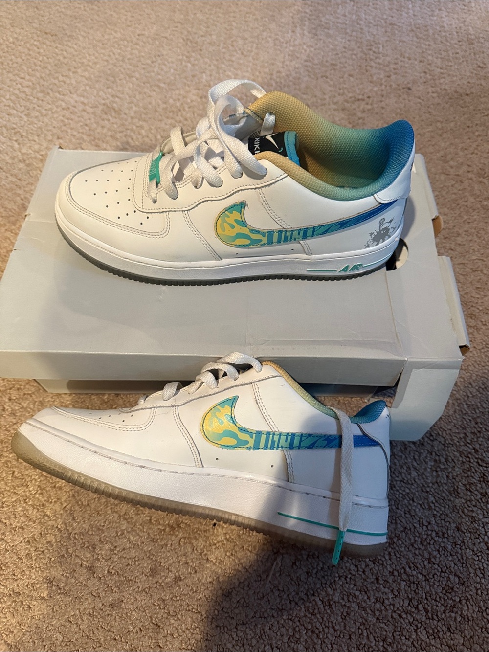 Nike White Sneakers with Teal and Yellow Accents.Size 7y big kids and 8.5 women